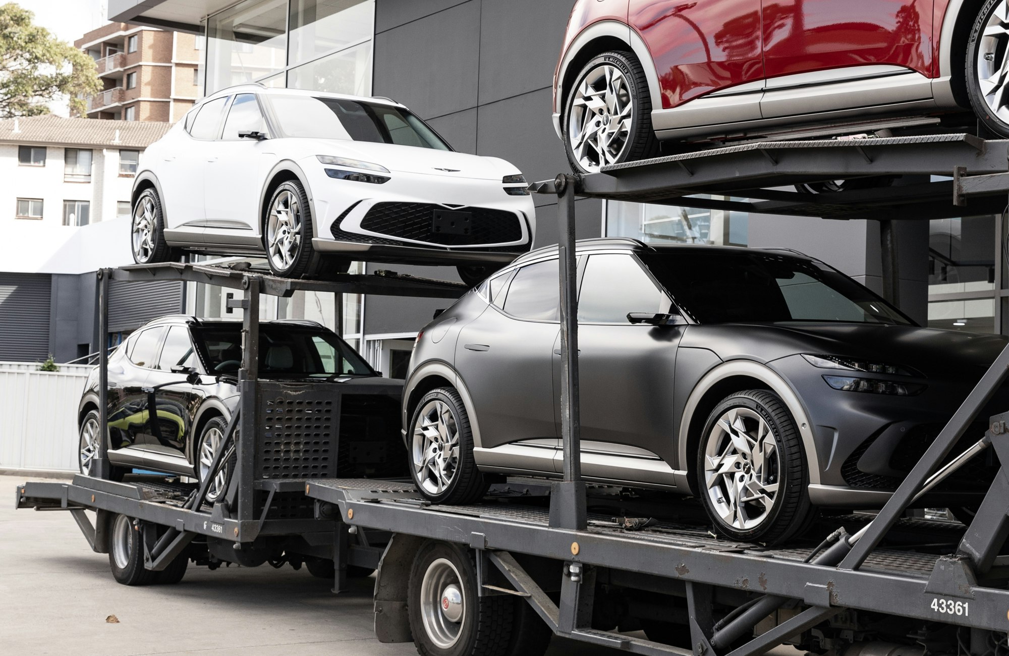 SUVs loaded on a multi-level car carrier